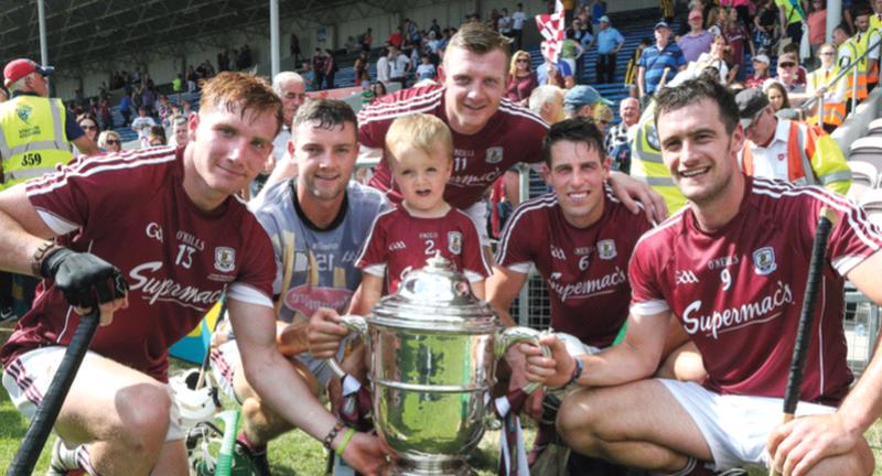 A proud four-year-old Jamie Tuohey with Galway players, his dad Adrian, Conor Whelan, Joe Canning, Gearóid McInerney and captain David Burke after they defeated Kilkenny in Sunday's Leinster hurling final replay at Semple Stadium. Photo: Joe O'Shaughnessy.