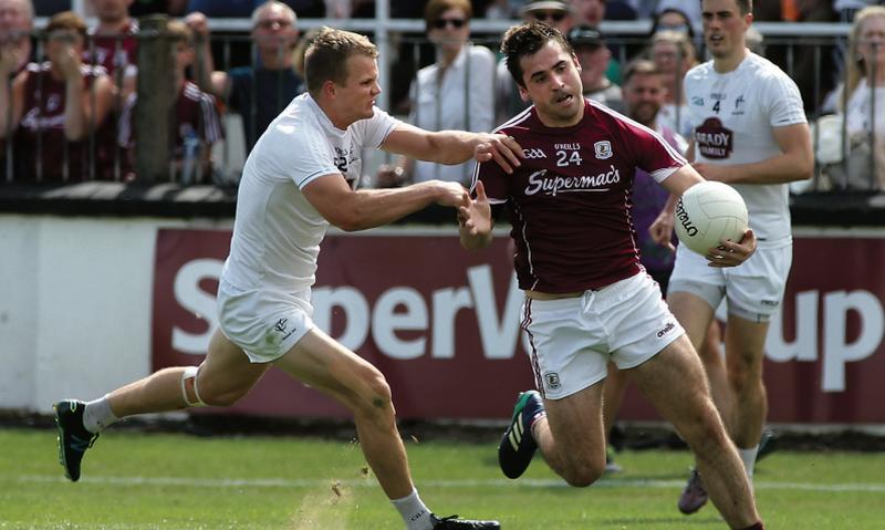 Galway's substitute Patrick Sweeney takes on Kildare's Peter Kelly during Sunday's Super 8s encounnter in Newbridge. Photo: Joe O'Shaughnessy.