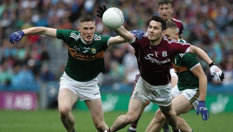 Galway's Ian Burke is first to the ball ahead of Kerry's Jason Foley and Peter Crowley during Sunday's All-Ireland football championship Super 8s clash at Croke Park. Photo: Joe O'Shaughnessy.