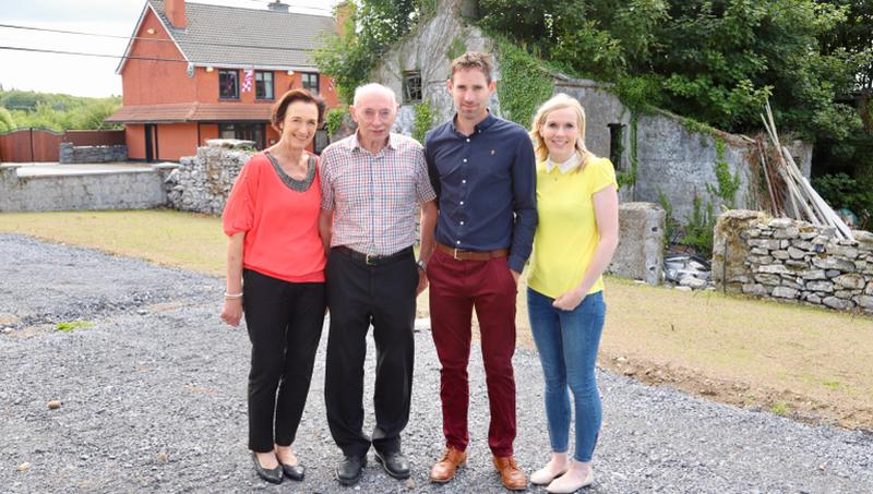 Nuala and Jack Kinnevey with son Jonathan and his wife Nollaig pictured in front of the remains of the original Kinnevey's pub and the current one across the road.