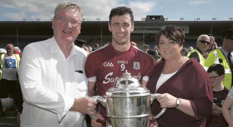 Galway GAA sponsors, Pat and Una McDonagh of Supermac's, with hurling captain David Burke after the Tribesmen won the Leinster final replay against Kilkenny at Semple Stadium last month.