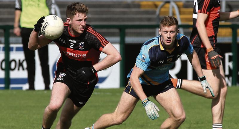 Barna's Seamus Kennedy breaking out of defence against Salthill Knocknacarra's Eoin McFadden during Sunday's senior football championship tie at Pearse Stadium. Photos: Joe O'Shaughnessy.