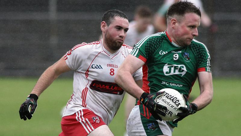 Kilconly's Teddy Kerrigan breaking away from Killererin's Gearoid Smyth during Saturday's senior football clash at Tuam Stadium. Photos: Joe O'Shaughnessy.