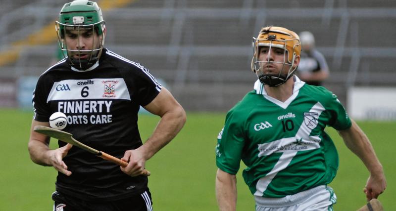 Colm Raftery of Padraig Pearses is chased by Moycullen's during Saturday's senior hurling championship tie at Pearse Stadium. Photos: David Cunniffe.