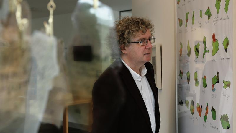 Jim Higgins, Heritage Officer for Galway City Council, viewing one of the exhibits at Sowing a Seed: Archives to Art exhibition at Tuam Library.