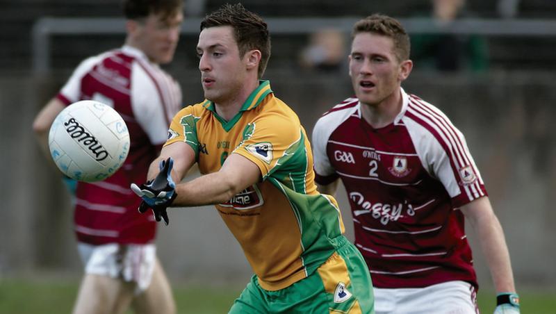 Corofin's Dylan Wall gets to the ball ahead of Annaghdown's Jonathan Creaven's during Sunday's Galway senior football semi-final at Tuam Stadium. Photo: Joe O'Shaughnessy
