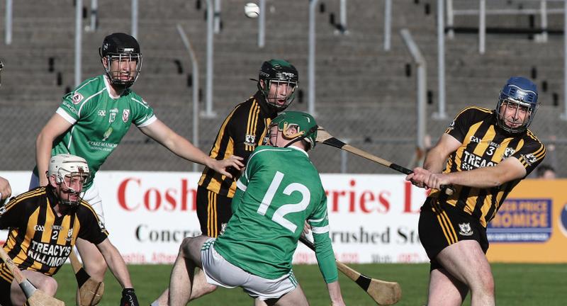 Killimor's Shane Boland gets his clearance away as team-mates Mike Winters and Noel Lyons, as well as the Ballinderreen duo of Aidan Duffy and Padraig Lafferty, look on. Photos: Joe O'Shaughnessy.