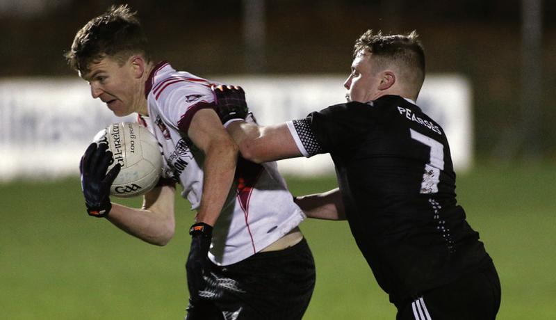 Fr Griffin's/Éire Óg's Darren Moylan comes under pressure from Gary Lally of Padraig Pearses during the County Junior A football final at Duggan Park last Friday. Photos: Joe O'Shaughnessy.