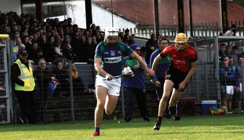 Shane Moloney of Tynagh Abbey Duniry shows a clean pair of heels to Tommy Larkins defender Shane O’Grady during the Senior Preliminary Quarter final in Ballinasloe on Sunday. Photos: Joe Keane.