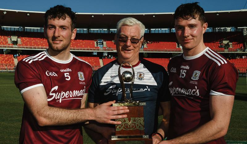 Galway captain Padraic Mannion and his brother Cathal, with the team's Kitman Tex Callaghan, and the Wild Geese trophy after their free-taking shootout victory over Kilkenny at Spotless Stadium, Sydney on Sunday. Photo: Ray McManus /Sportsfile