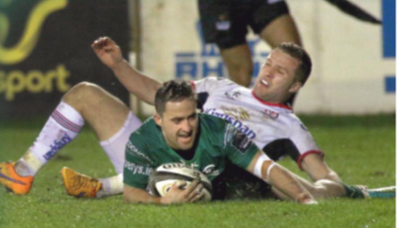 Connacht scrum half Caolin Blade scores his team's third try despite the best efforts of Ulster's Johnny McPhillips at the Sportsground on Friday night. Photo: Joe O'Shaughnessy.