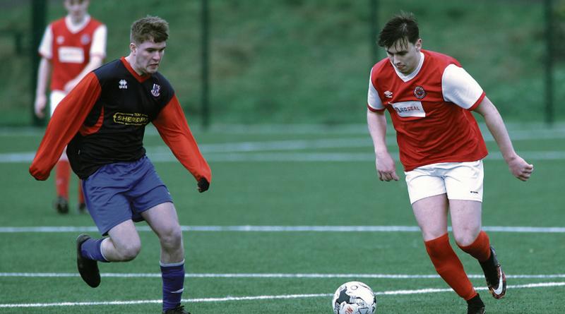 Colga FC's Ryan Lillis on the ball against David O'Malley of Knocknacarra FC during the clubs' Division Two clash at Cappagh Road. Photo: Joe O'Shaughnessy.