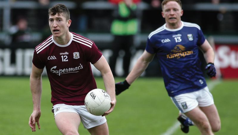 Galway's Johnny Heaney on the attack against Jack Brady of Cavan during Sunday's National Football League tie at Pearse Stadium. Photo: Joe O'Shaughnessy.