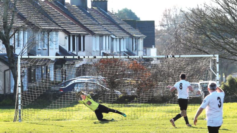 Renmore B goalkeeper Stephen Doherty saves a penalty taken by Craughwell United's Patrick Phillips.