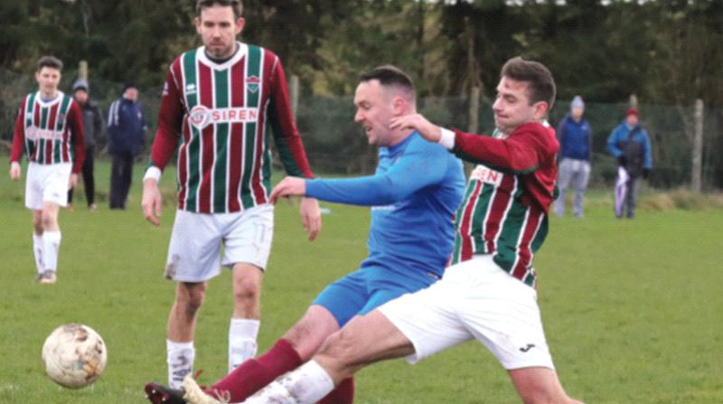 Strong tackling by Gavin O'Leary of Merlin Woods/Medtronic on Athenry's Stephen Cunningham as Joe Gibbs awaits the outcome when the teams met in the Galway Football League Premier Division at Raheen on Saturday. Photos: KENNEDY/EIREFOTO