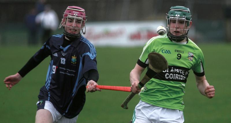 Colaiste na Coiribe’s Colm Ó Cuinneagáin breaking away from Mercy College, Woodford's Paul Fahy during the Connacht Post Primary Schools Senior C hurling final at Duggan Park on Saturday. Photos: Enda Noone.