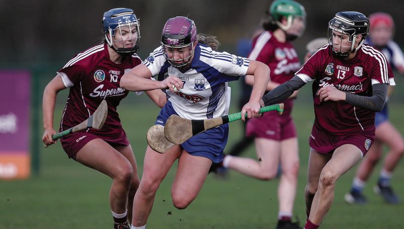 Galway's Niamh Hanniffy and Carrie Dolan try to halt the progress of Waterford's Caoimhe McGrath during Sunday's National Camogie League tie in Waterford IT. Photo: Inpho/Laszlo Geczo.
