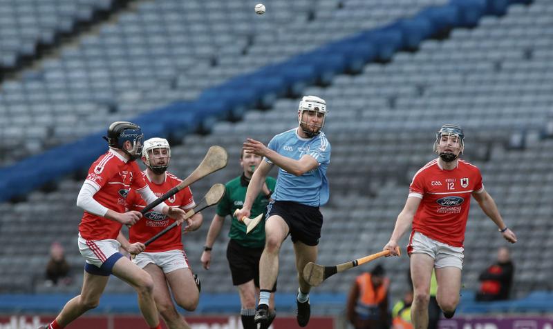 Oranmore/Maree's Liam Keane gets his clearance away despite being surrounded by Charleville's Cathal Carroll, Darren Casey and Jack Doyle. Photos: Joe O'Shaughnessy.