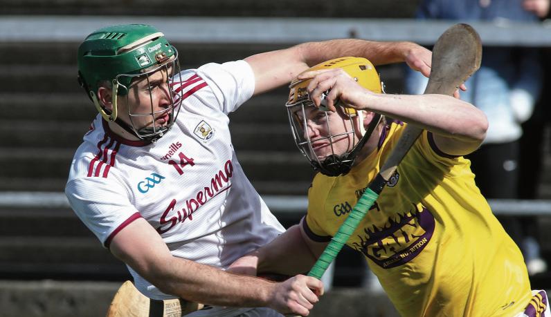 Galway's Brian Concannon tries to halt the progress of Wexford's Simon Donohoe during Saturday's National Hurling League quarter-final at Pearse Stadium. Photos: Joe O'Shaughnessy.