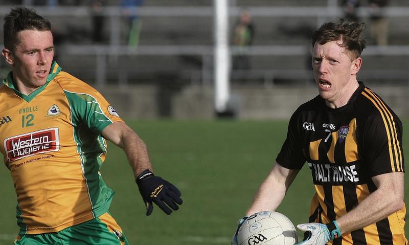 Jason Leonard in action for Corofin against Mountbellew-Moylough’s Paul Donnellan during the county final replay in November.