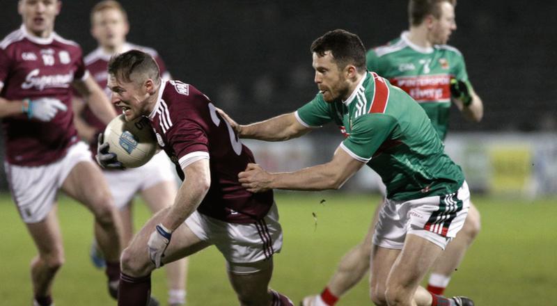Galway attacker Danny Cummins breaking away from Mayo's Chris Barrett during Saturday's Divsion One National Football League clash at MacHale Park. Photo: Joe O'Shaughnessy.