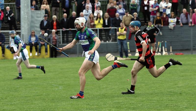 Tynagh/Abbey-Duniry's Padraig Brehony is chased by Cappataggle's Darragh Dolan at Duggan Park.