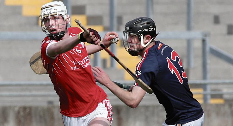 St Raphael's Evan Cox breaking past the challenge of Ciaran Cooney of Castlecomer Community School during Saturday's All-Ireland Post Primary Schools Senior B final at O'Connor Park, Tullamore. Photo: Joe O'Shaughnessy.