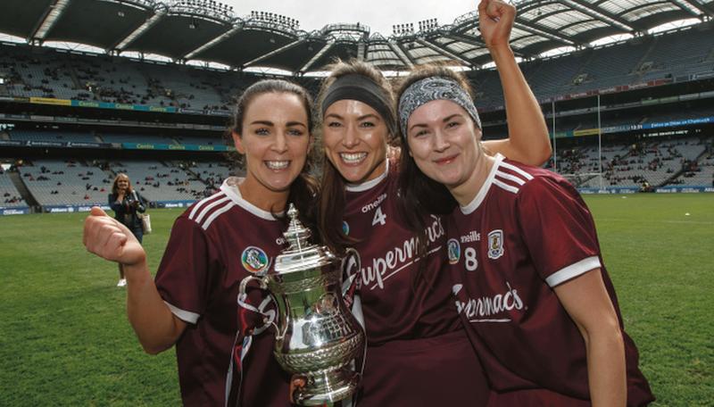 Galway players Noreen Coen, Heather Cooney and Anne Marie Starr show their delight after overcoming Kilkenny in Sunday's National League camogie final at Croke Park. photo: INPHO/James Crombie.