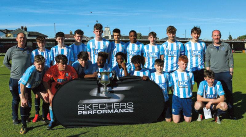 The Salthill Devon side which captured the SFAI U-16 Cup in Cork last weekend. Back row, from left: Joe Tracey (assistant manager), Luke Brennan, Macron Kenny, Louis Corrs, Rory O’Brien, Andreas Fernandez, James Busari, Ben O’Malley, Ryan Kavanagh Joe Murray, and John ‘Jumbo’ Brennan (manager). Front: Jay Martyn, Andrew Sherlock, Callum Loomes, Shane Befuela, Uyi Uyiosa, Aaron Dossen, Leo Byrne, Harry Brown, and Sean Flaherty. Photo: Michael P Ryan/Sportsfile.