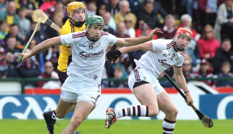 Galway's Brian Concannon getting to the ball ahead of Wexford's Simon Donohoe during Sunday's Leinster hurling championship clash at Pearse Stadium. Photo: Joe O'Shaughnessy.