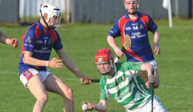 Killimordaly's Ian Cannon is about to get the ball away despite the attentions of St Thomas' Kenneth Murray during the 2018 county U21 A1 final at Duggan Park last Thursday. Photos: Joe O'Shaughnessy.