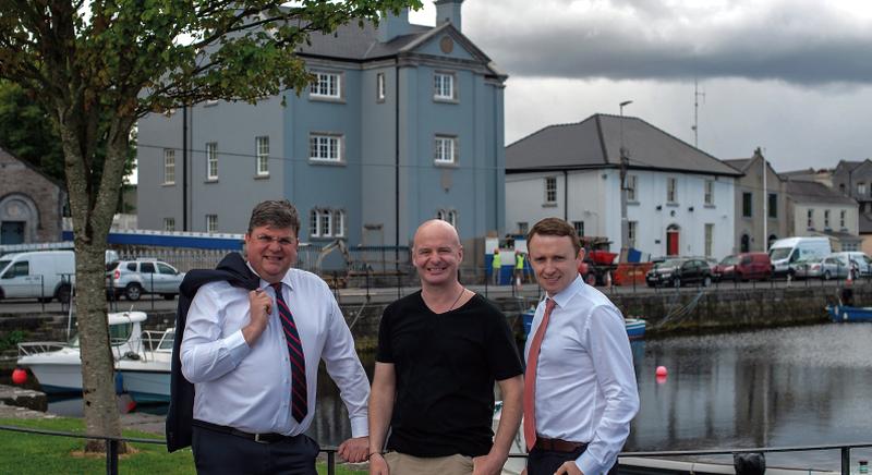 Pictured across from the newly renovated Piscatorial School are (from left) Paul Carey; MD of Carey Contractors Galway; Michael Gibbons, MD, Fort Eyre Developments, Paul Dullaghan, AIB.