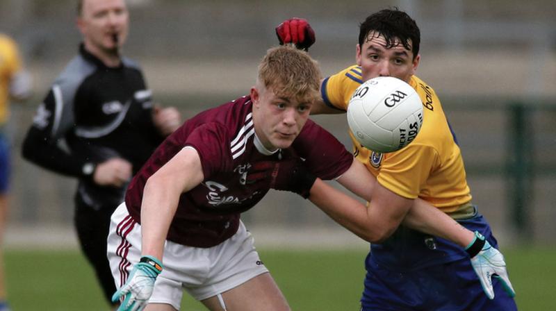 Galway's James McLaughlin tussling for possession with Roscommon's Jack McDermott during Friday night's Connacht minor football championship tie at Hyde Park. Photos: Joe O'Shaughnessy.