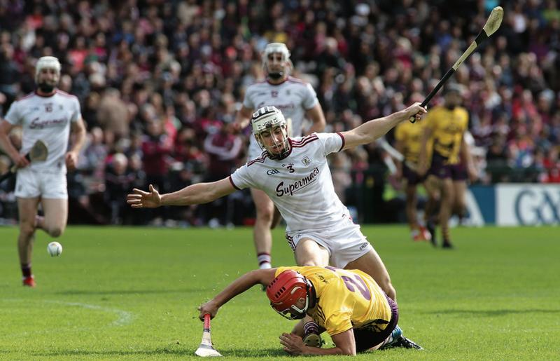 Galway full back Daithí Burke giving Wexford's Paul Morris no quarter during Sunday's Leinster hurling championship clash at Pearse Stadium. Photo: Joe O'Shaughnessy.