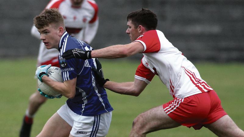 Milltown's Liam Costello comes under pressure from Kevin Murphy of Killererin during Saturday evening's senior football championship tie at Tuam Stadium. Photos: Joe O'Shaughnessy.