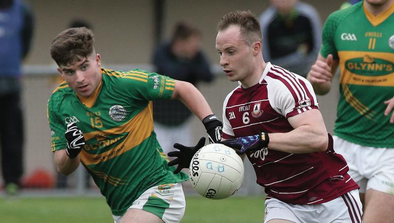 Annaghdown's Joe Kerin breaking out of defence against Barry Goldrick of Claregalway during Saturday's senior football championship tie at Kenny Park. Photos: Joe O'Shaughnessy.