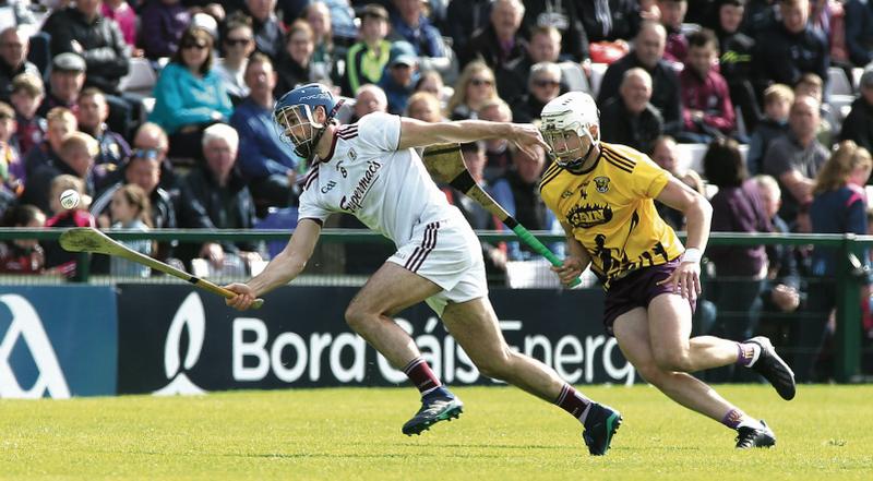 Galway midfielder Johnny Coen is chased by Wexford's Rory O'Connor during Sunday's Leinster hurling championship round-robion tie at Pearse Stadium. Photos: Joe O'Shaughnessy.