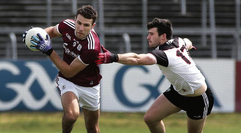 Galway's Fiontán Ó Curraoin is challenged by Sligo's Pat Hughes during Sunday's Connacht senior football semi-final at Markievicz Park. Photo: Joe O'Shaughnessy.