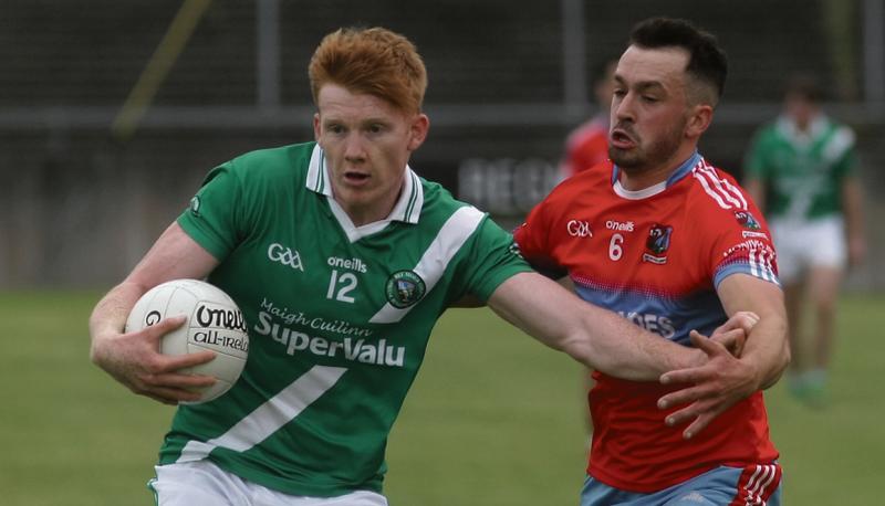 Moycullen's Peter Cooke tries to fend off the challenge of Monivea-Abbey’s Barry McDonagh during Saturday's senior football championship tie at Tuam Stadium. Photos: Enda Noone.