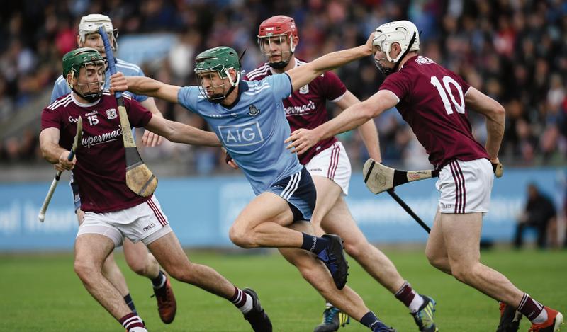 Dublin's Chris Crummey is surrounded by Galway players Brian Concannon, Jonathan Glynn and Cathal Mannion during Saturday evening's Leinster hurling championship tie at Parnell Park. Photos: Ramsey Cardy/Sportsfile